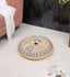 Embroidered yellow upholstered floor cushion with intricate design