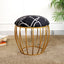 Black abstract fabric stool with a gold cage-style metallic base