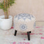 Blue ethnic stool with intricate embroidery and wooden legs