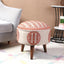 Red ottoman stool with ethnic embroidery and intricate patterns