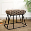 Ethnic printed suede metallic stool with a sleek black base