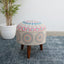 Embroidered upholstered wooden stool with a lotus design