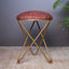 Floral printed suede fabric stool with a cross metallic base