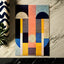 Vibrant geometric hand-tufted wool carpet with multicolor design