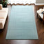 Minimalist embossed wool rug, hand-tufted solid color for modern decor