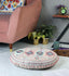 Embroidered pink upholstered floor cushion with elegant design