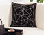 Brown cushion cover with embroidered triangle design