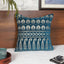 Char Minar decorative cushion cover in turquoise with intricate design