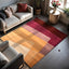 Hand-tufted wool rug with geometric design in warm earthy tones