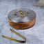 Silver lidded roti box with a sleek, traditional design