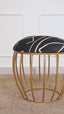 Black abstract fabric stool with a gold cage-style metallic base